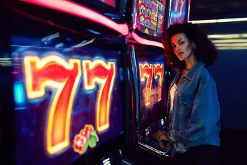 KOKOZINO App — Fast, responsive, and optimized for all devices A cheerful woman in traditional clothing using her smartphone during a festive moment, showing how easily the KOKOZINO app fits into everyday life.