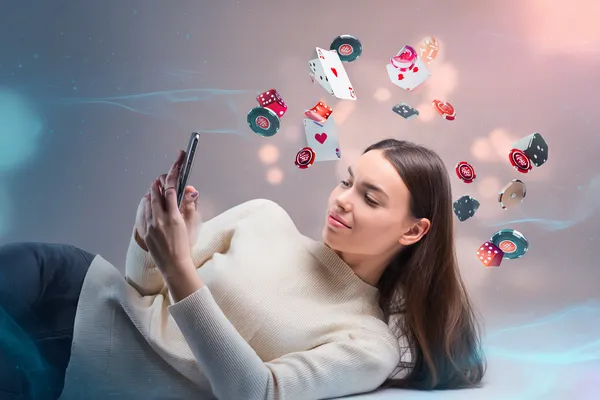 A close-up shot of golden coins falling around a spinning roulette wheel, representing immersive casino action at KOKOZINO.